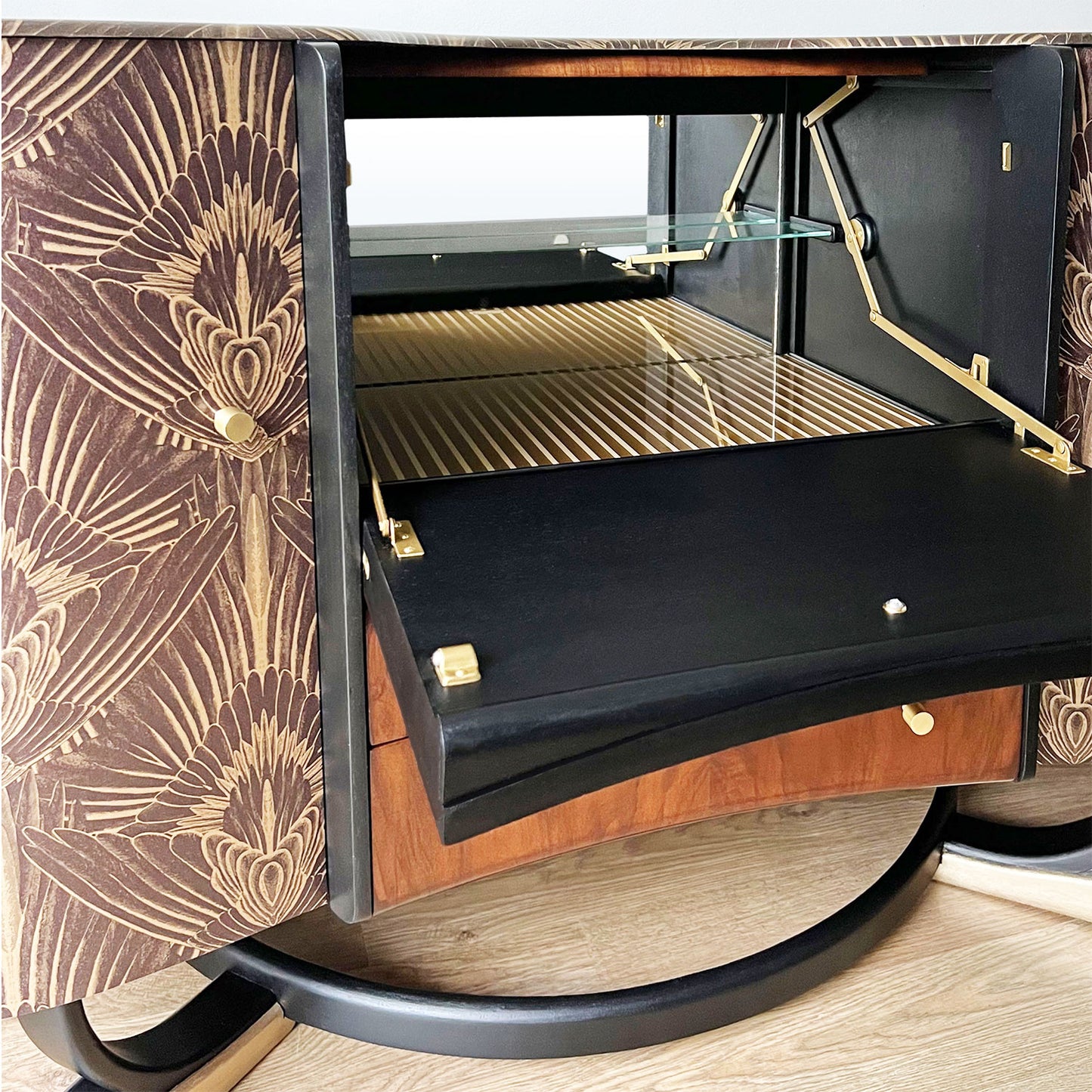 Vintage Beautility cocktail cabinet with illuminated drop-down bar, featuring original mirror and gold pinstriped glass protector.