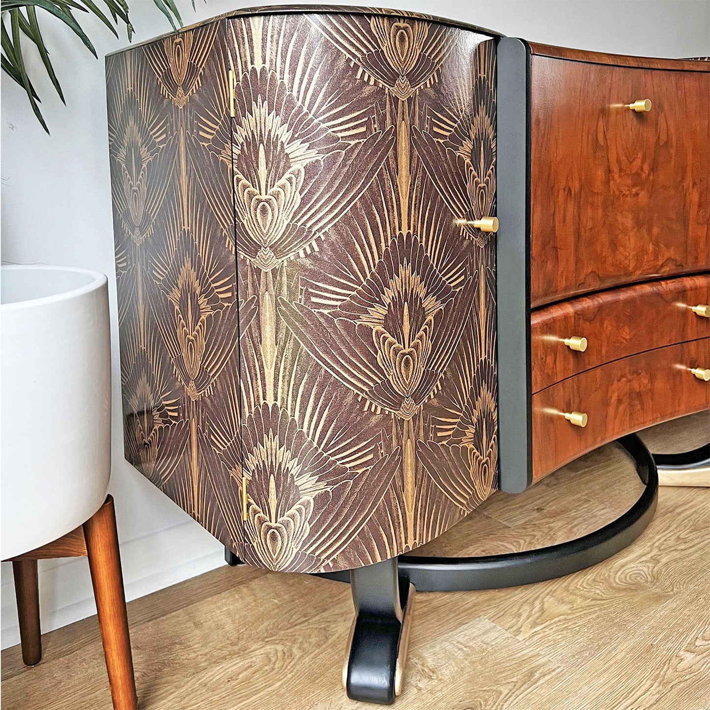 Elegant curved legs of Art Deco cocktail cabinet, refinished in specialist black and gold paint with felt sliders for floor protection.