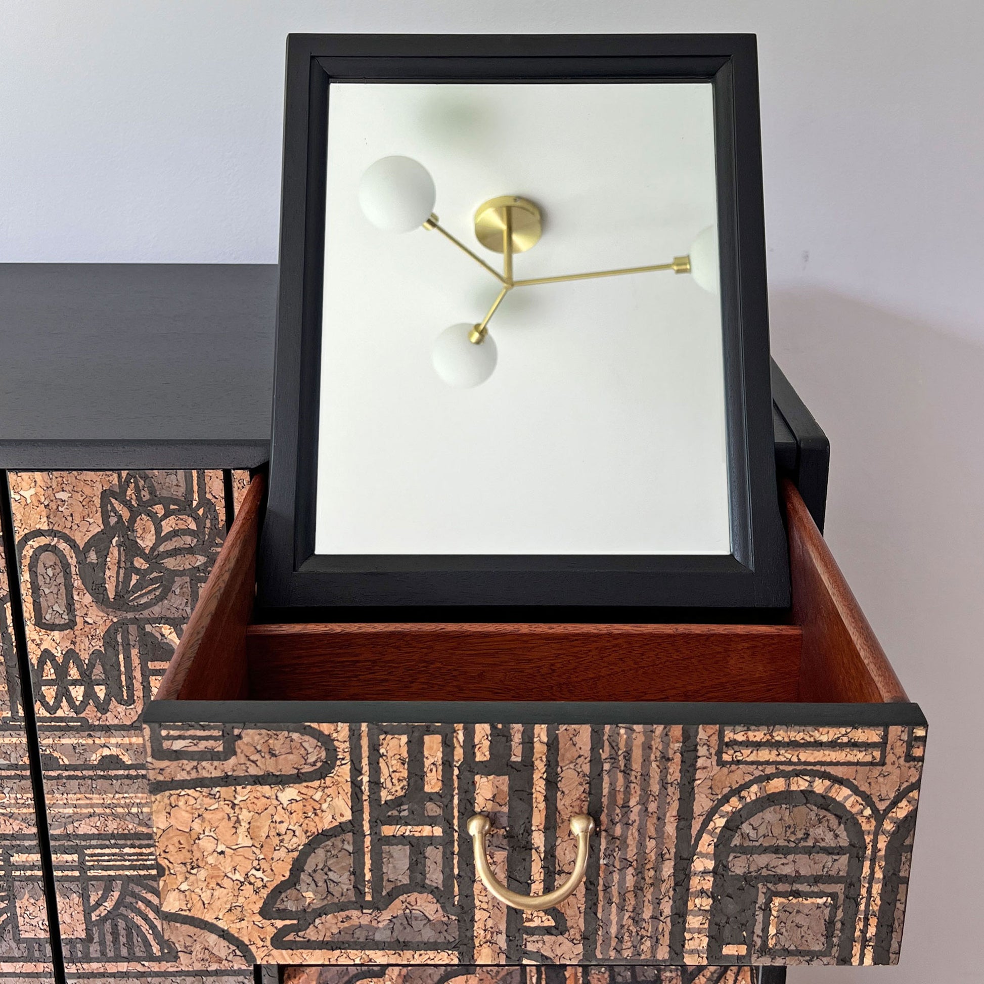 Hidden mirror inside the top drawer of the G Plan Librenza drinks cabinet, providing a discreet and functional feature for cocktail preparation.