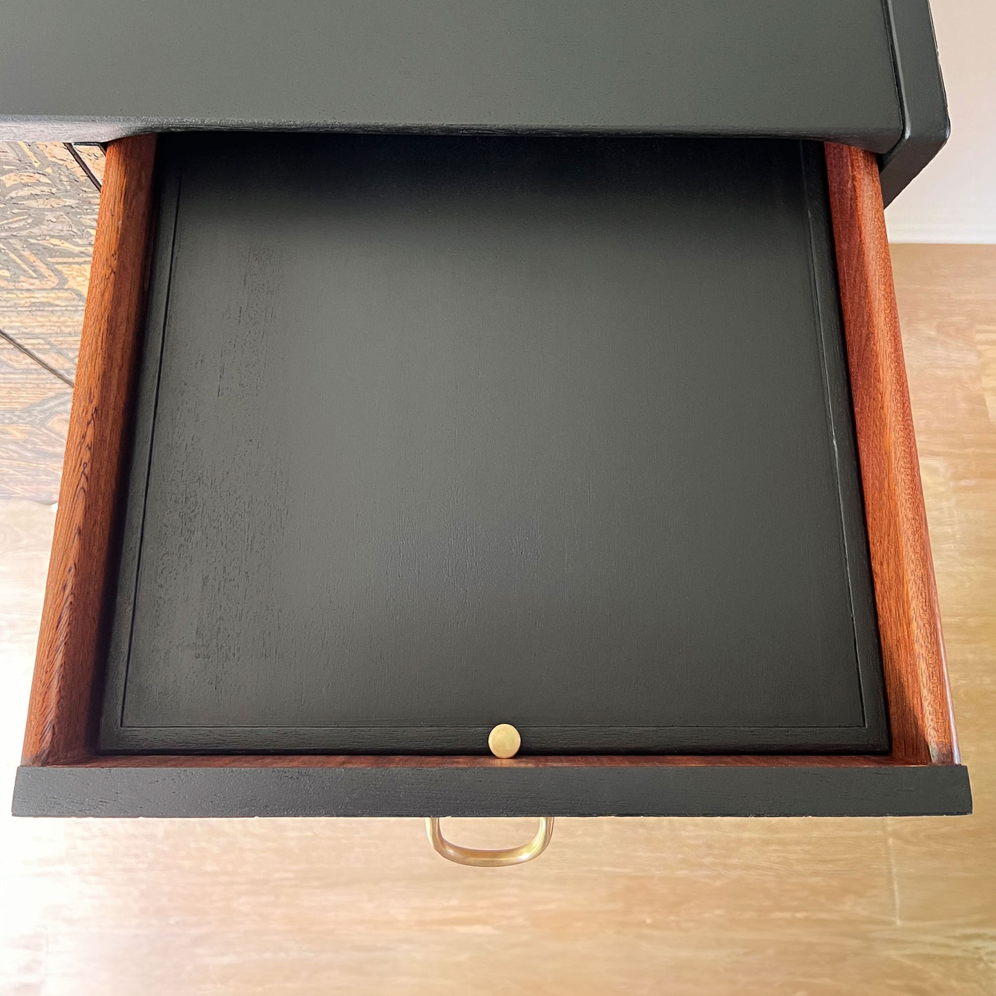 Refurbished drawers of the G Plan Librenza drinks cabinet, featuring original solid brass pulls and a hidden mirror in the top drawer for convenience.