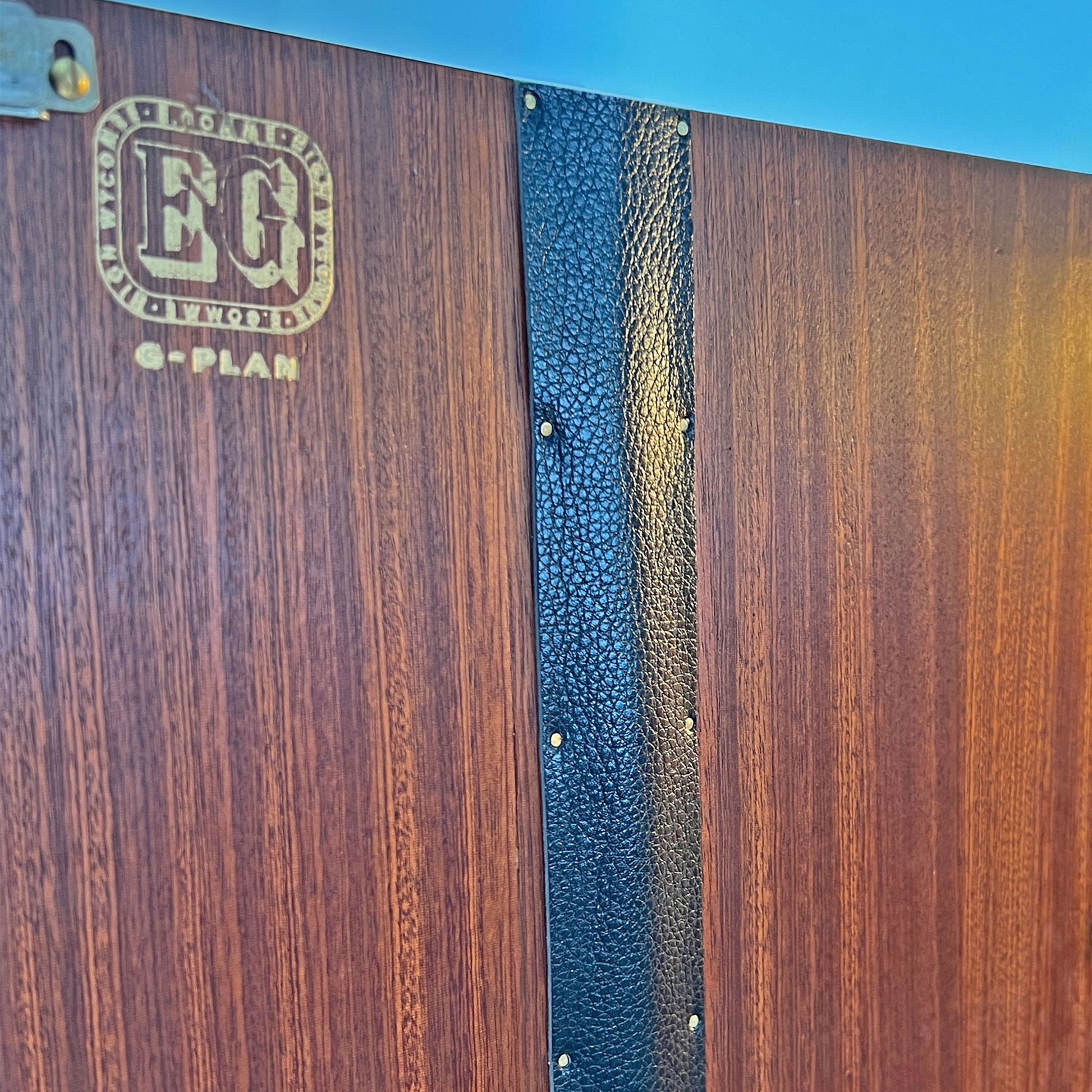 Close-up of the original G Plan gold stamp on the G Plan Librenza drinks cabinet, highlighting its mid-century authenticity and heritage.