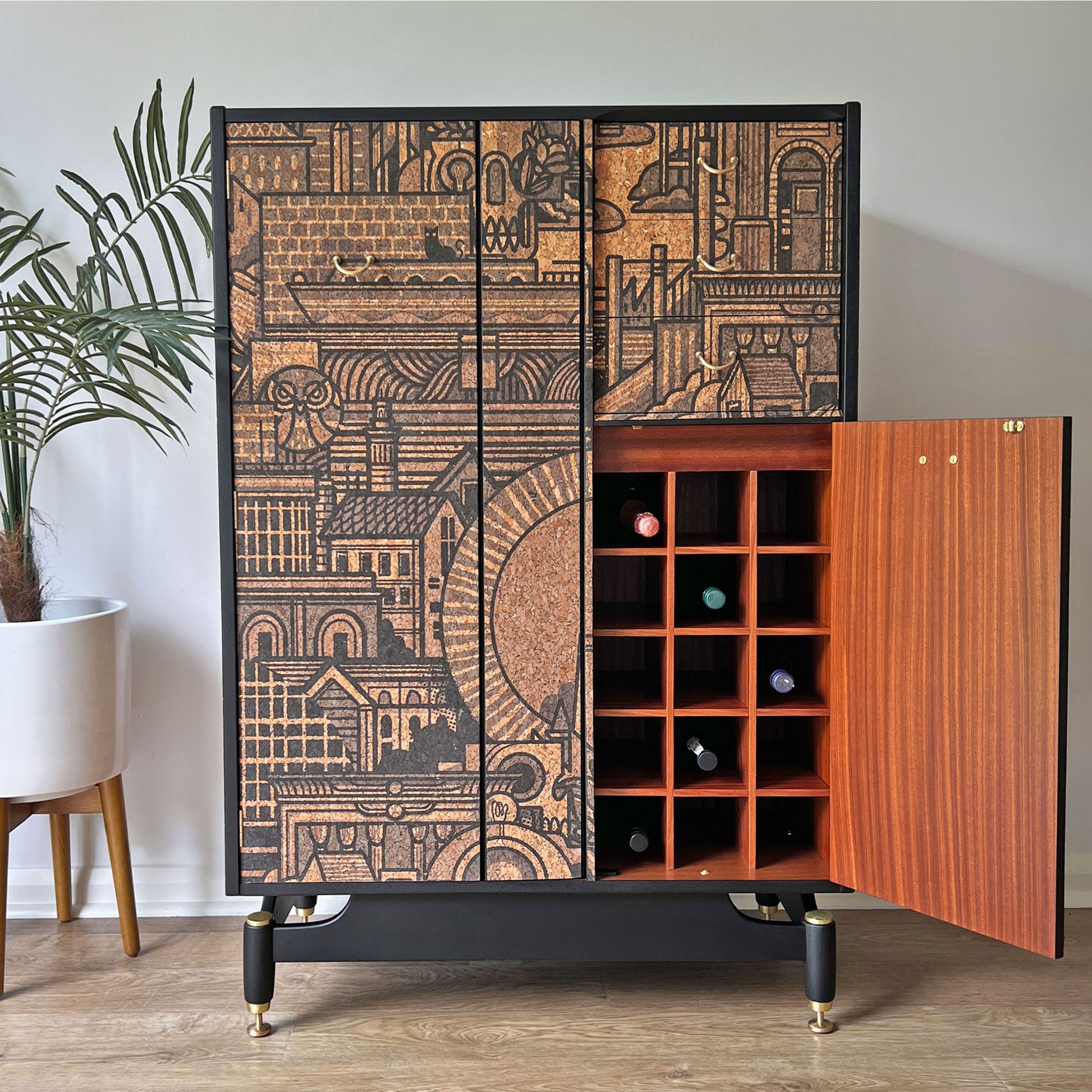 Dedicated wine bottle storage inside the G Plan Librenza drinks cabinet, holding up to 15 bottles in a custom-built rack.