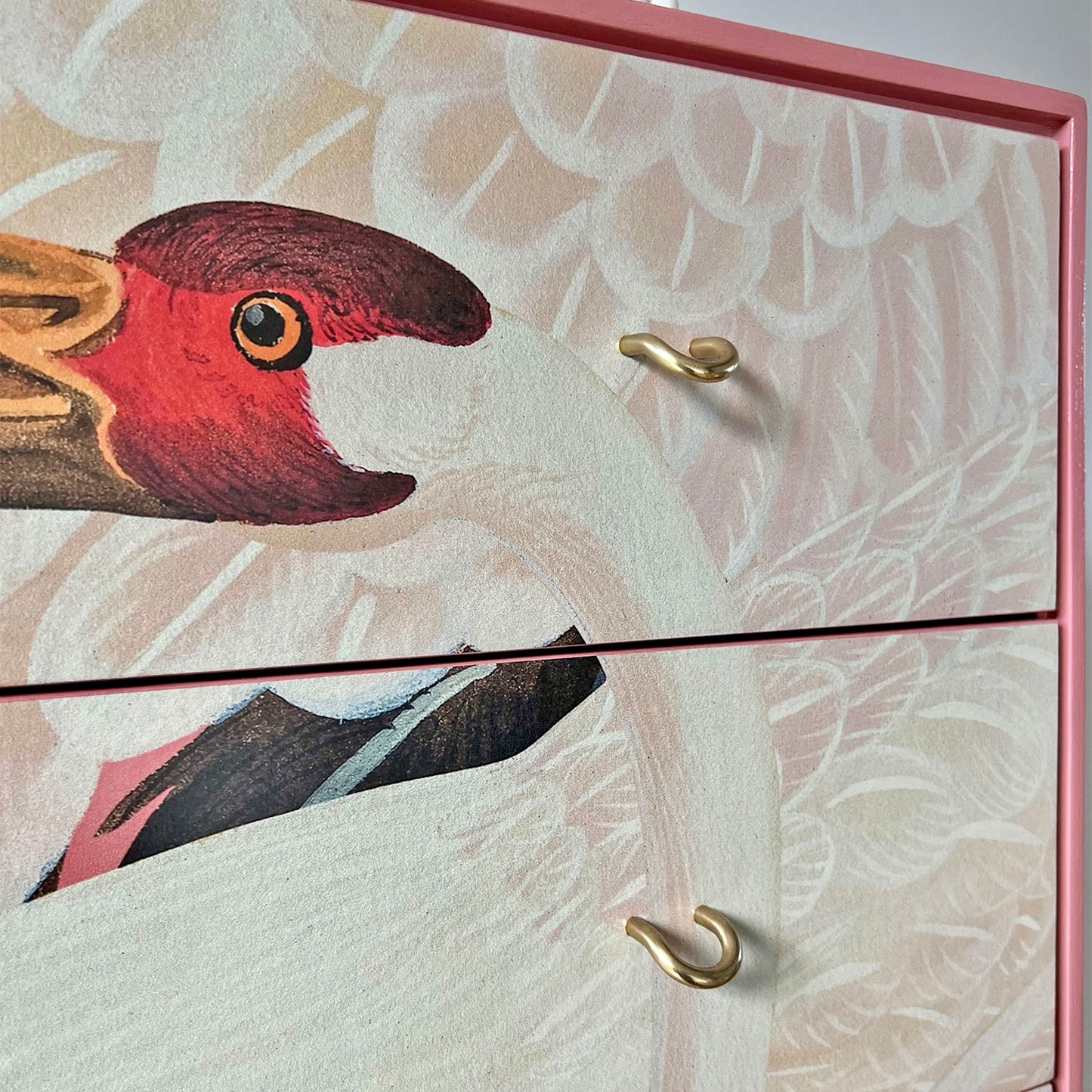 Close-up of pink Gucci Heron print decoupage on Stag C Range tallboy, sealed with durable varnish for a luxurious and long-lasting finish.