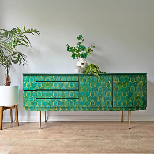 Vintage sideboard with Bethan Gray-inspired iridescent shell-like decoupage, solid brass legs, and green painted finish for a contemporary statement piece.