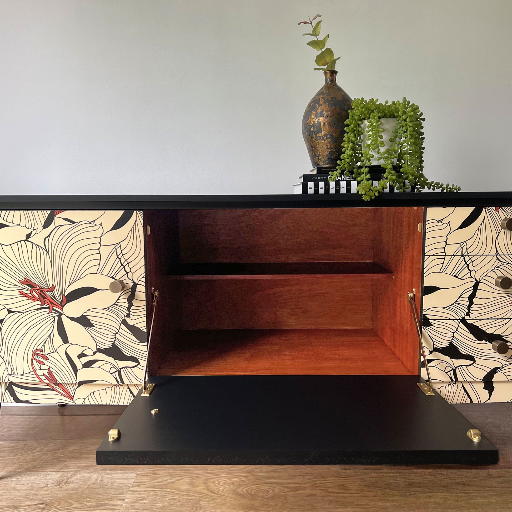 Beautility sideboard with unique drop-down central cupboard.