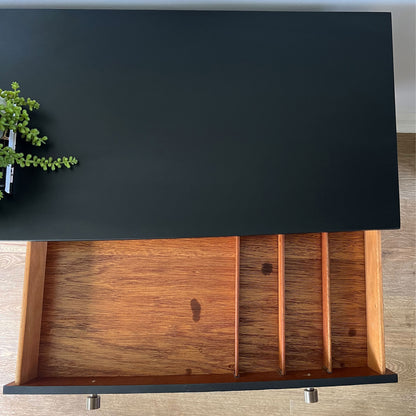 Beautility sideboard with spacious storage, featuring three drawers.