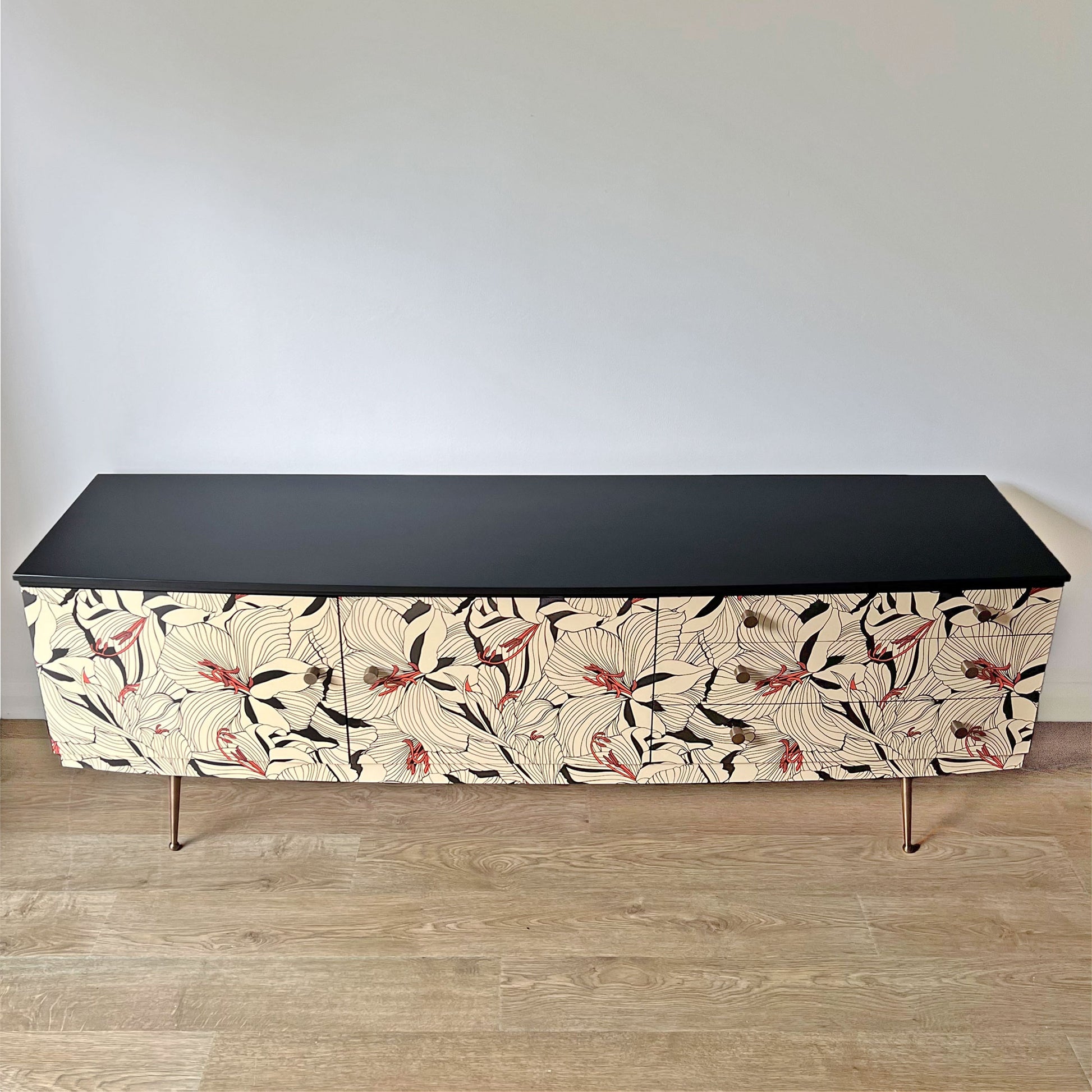 Top view of Beautility sideboard with smooth black finish and contrasting Gucci 'Lilies' decoupage design.