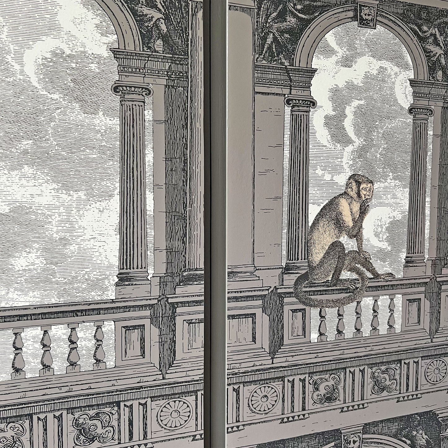 Close-up of Cole & Son x Fornasetti 'Procuratie con Vista' design on luxury drinks cabinet, depicting Venetian arches with whimsical monkeys.