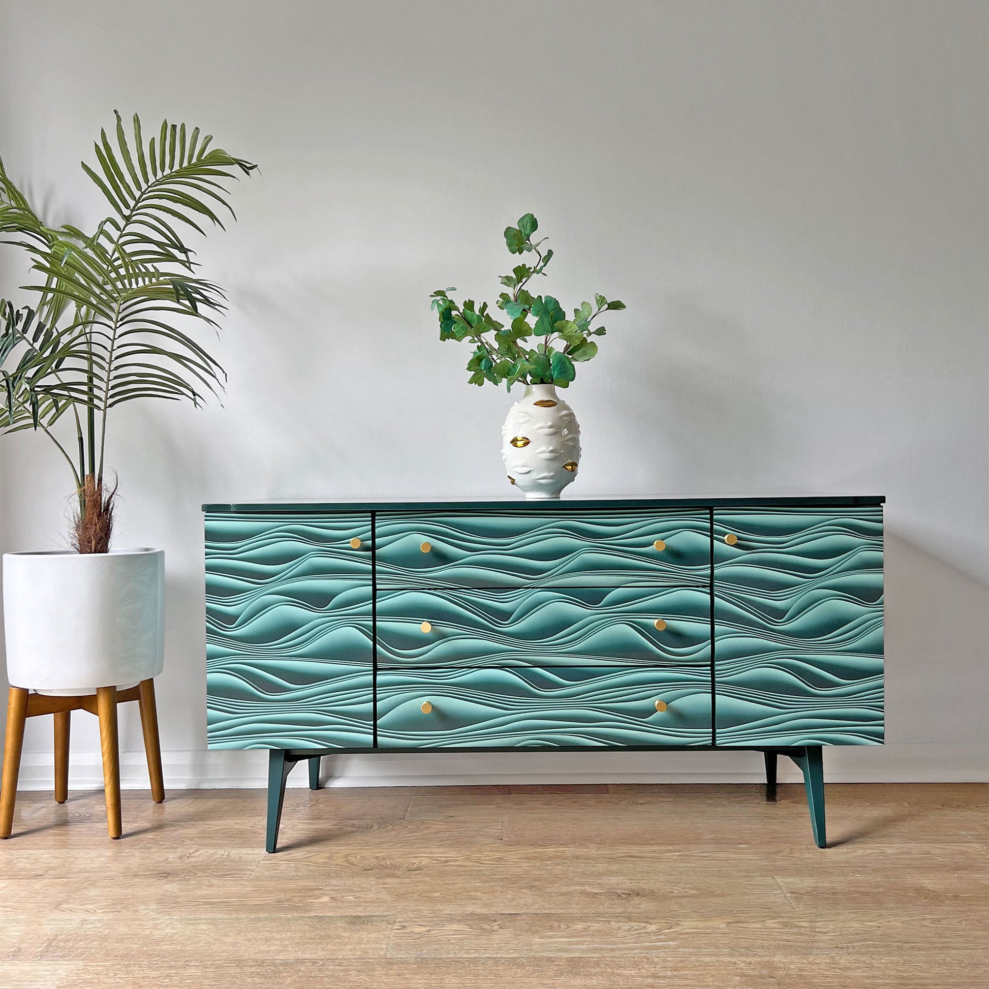 Vintage Meredew sideboard transformed with Carmine Lake Marianas wallpaper, featuring a striking 3D paper fold design in a bold contemporary finish.