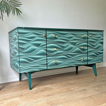 Close-up of Marianas decoupage on Meredew sideboard, featuring a dynamic 3D paper fold design by Carmine Lake for a bold, fluid effect.