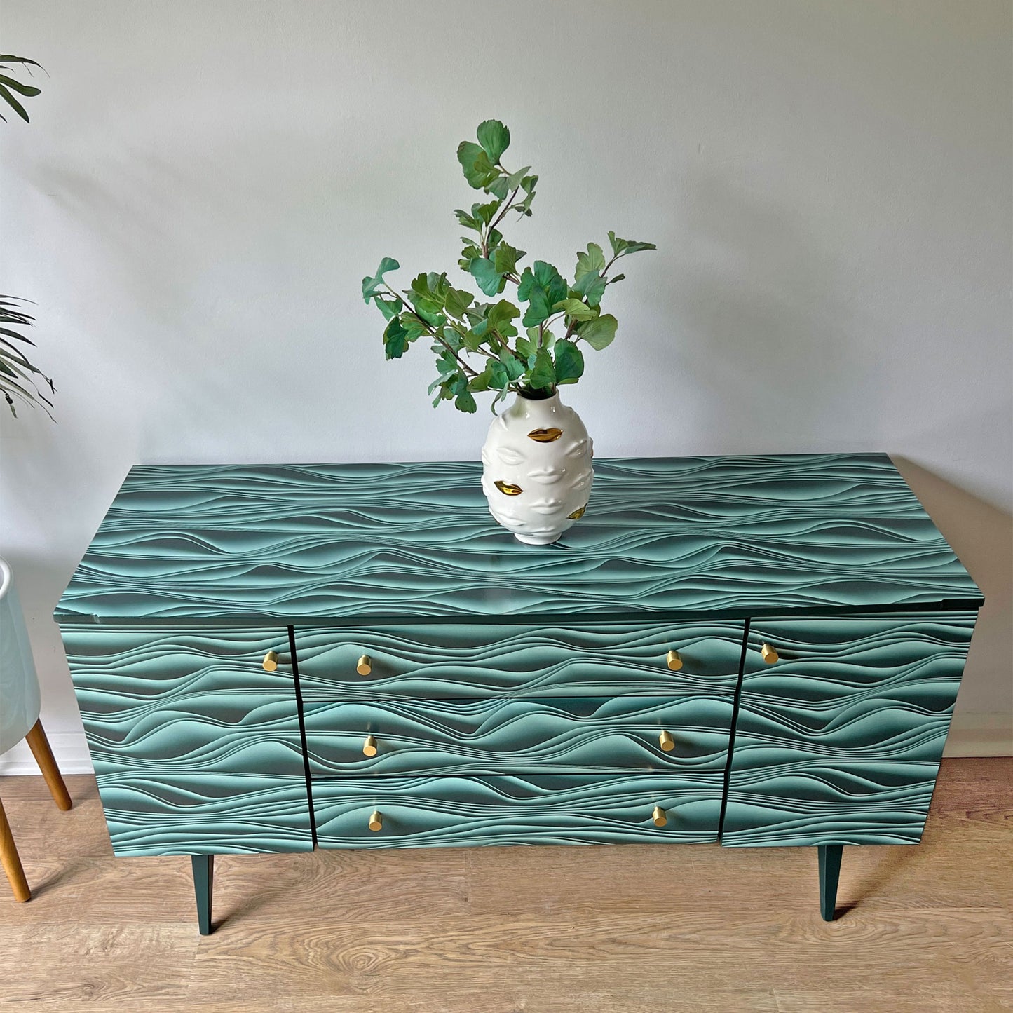 Top view of vintage Meredew sideboard, highlighting the smooth refinished wood and contemporary Marianas decoupage pattern.