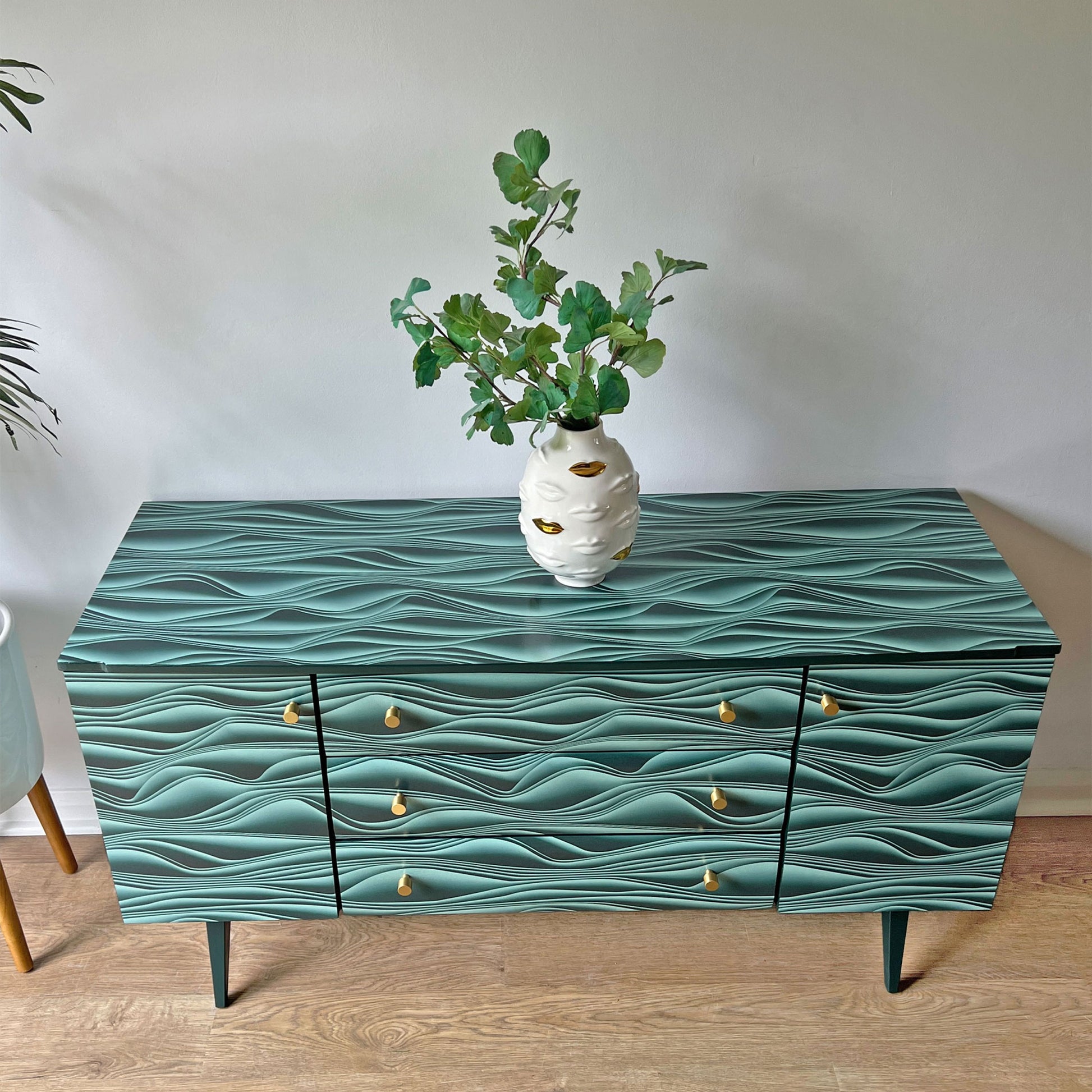 Top view of vintage Meredew sideboard, highlighting the smooth refinished wood and contemporary Marianas decoupage pattern.