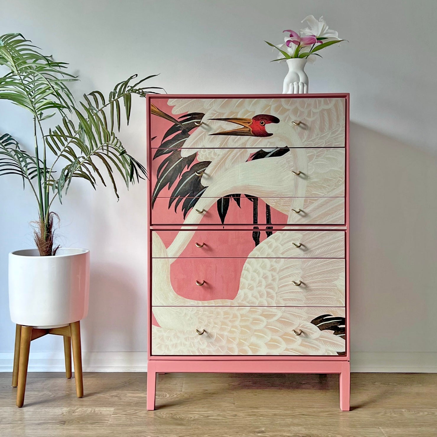 Vintage Stag C Range tallboy transformed with Gucci Heron pink decoupage, featuring six spacious drawers and polished brass handles.