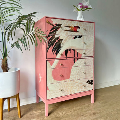 Side profile of Stag C Range tallboy, featuring bold pink Gucci Heron decoupage and sleek Mid-Century Modern construction.