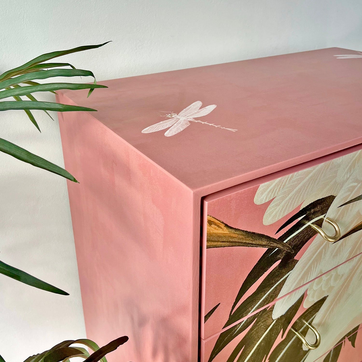 Top view of Stag C Range tallboy, showcasing its pink Gucci Heron print and smooth, varnished finish.
